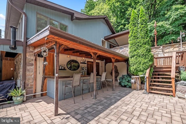 view of patio with a bar