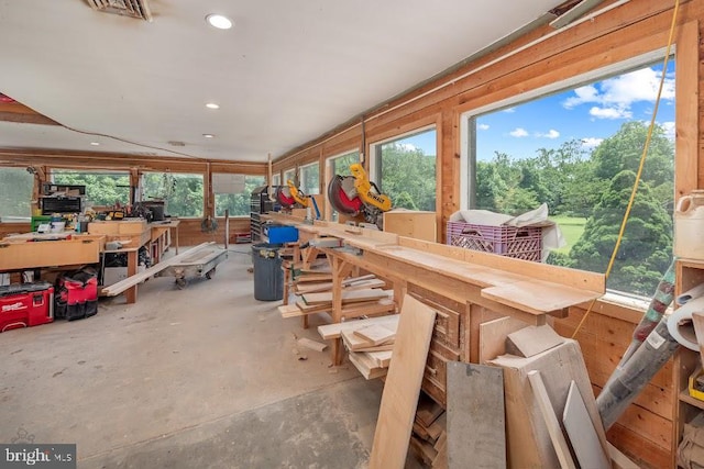 sunroom / solarium with a workshop area