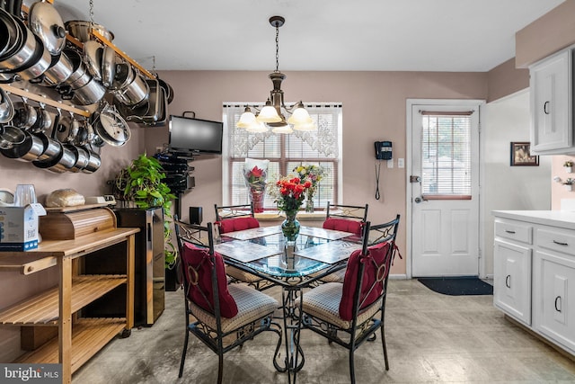 dining space featuring an inviting chandelier