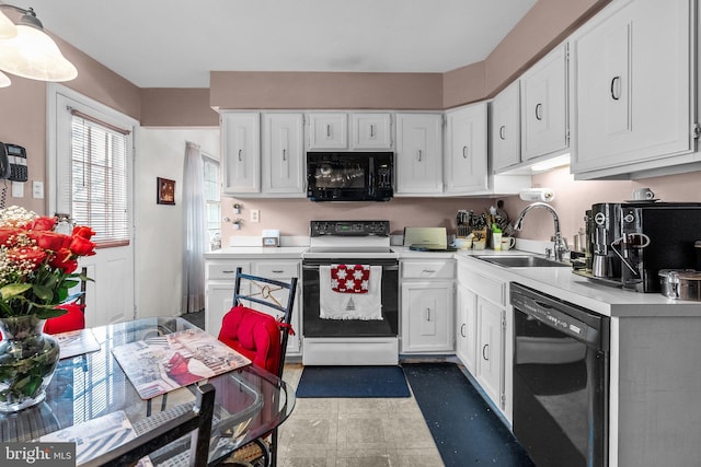 kitchen with white cabinets, sink, and black appliances