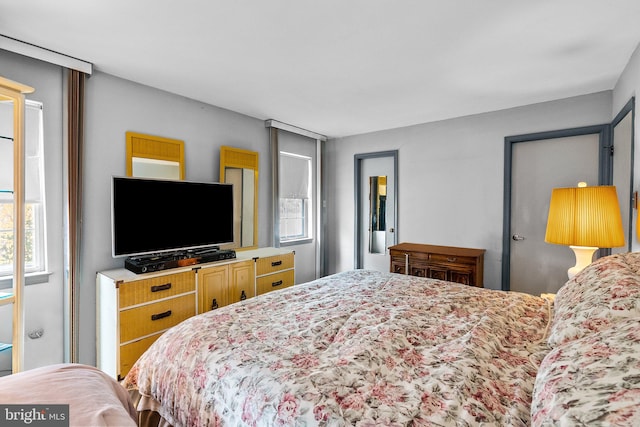 bedroom featuring multiple windows