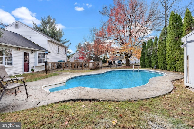 view of swimming pool with a patio area