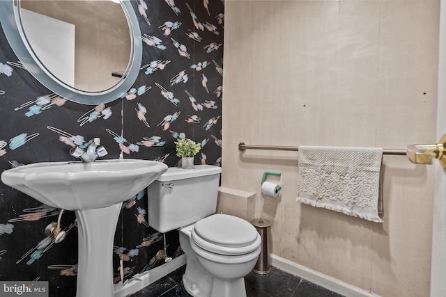 bathroom featuring tile patterned floors and toilet