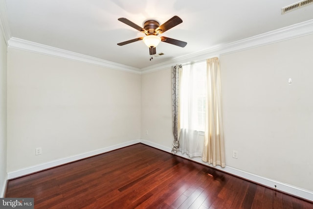 spare room featuring crown molding, ceiling fan, plenty of natural light, and dark hardwood / wood-style flooring