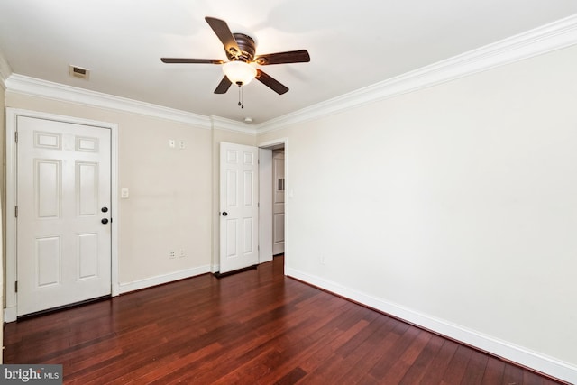 empty room with ceiling fan, ornamental molding, and dark hardwood / wood-style flooring