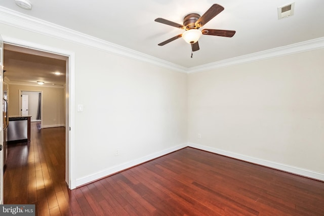 unfurnished room featuring dark hardwood / wood-style flooring and ornamental molding