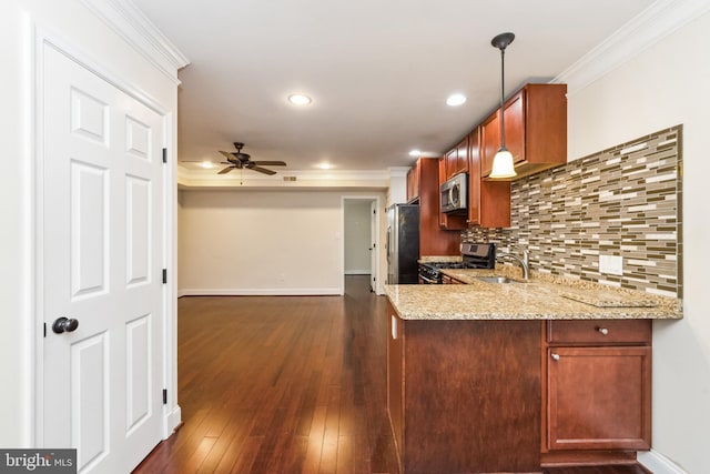 kitchen featuring appliances with stainless steel finishes, tasteful backsplash, hanging light fixtures, kitchen peninsula, and crown molding