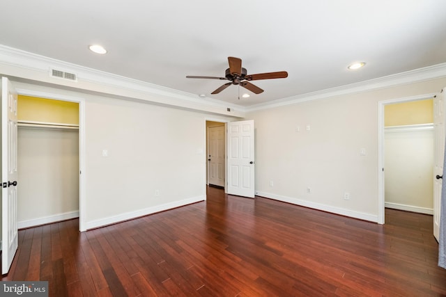 unfurnished bedroom with ceiling fan, ornamental molding, and dark hardwood / wood-style floors