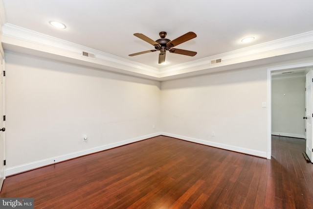 unfurnished room with dark hardwood / wood-style flooring, ornamental molding, and ceiling fan