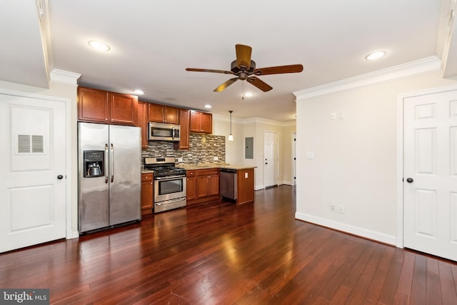 kitchen featuring appliances with stainless steel finishes, pendant lighting, decorative backsplash, electric panel, and crown molding