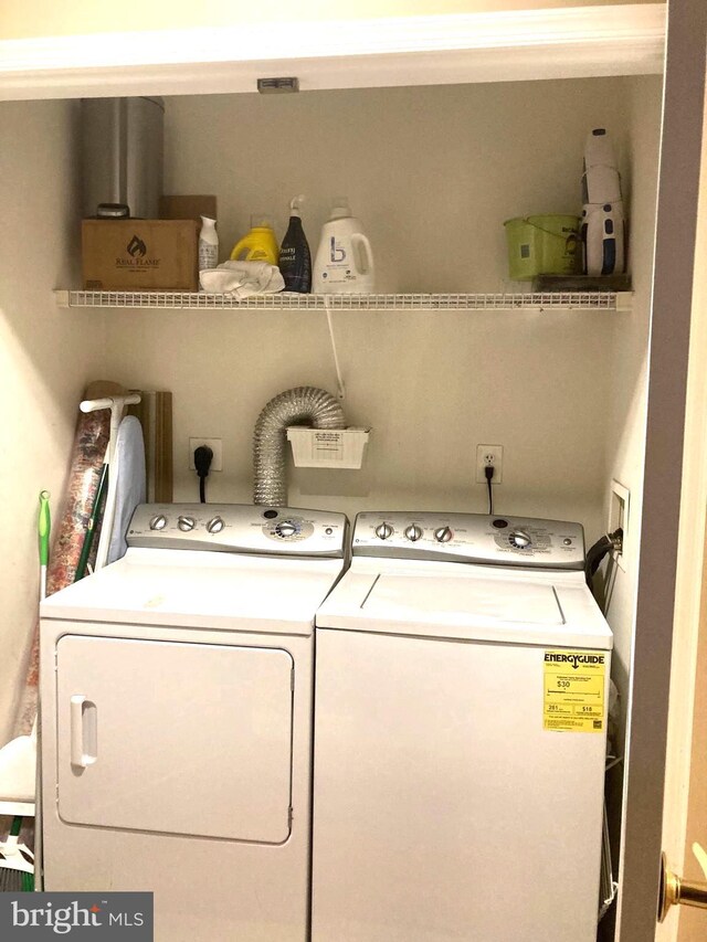 washroom with independent washer and dryer