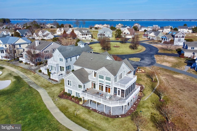 birds eye view of property with a water view