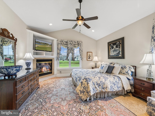 bedroom with ceiling fan and lofted ceiling