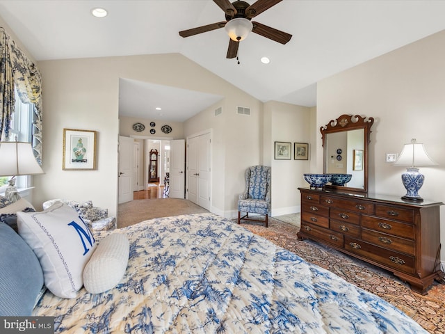 bedroom with lofted ceiling, ceiling fan, and a closet