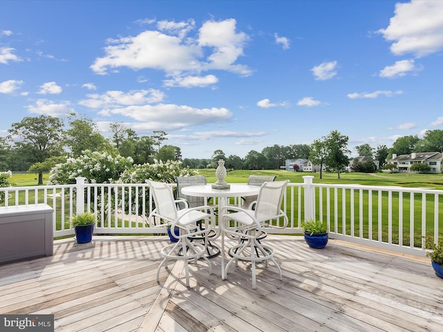 wooden deck with a yard