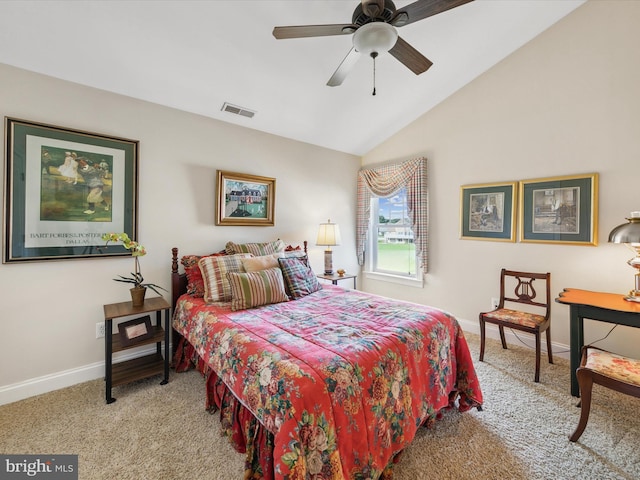 bedroom featuring vaulted ceiling, light colored carpet, and ceiling fan