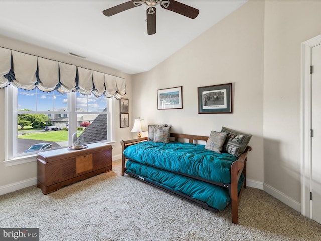 carpeted bedroom with lofted ceiling and ceiling fan