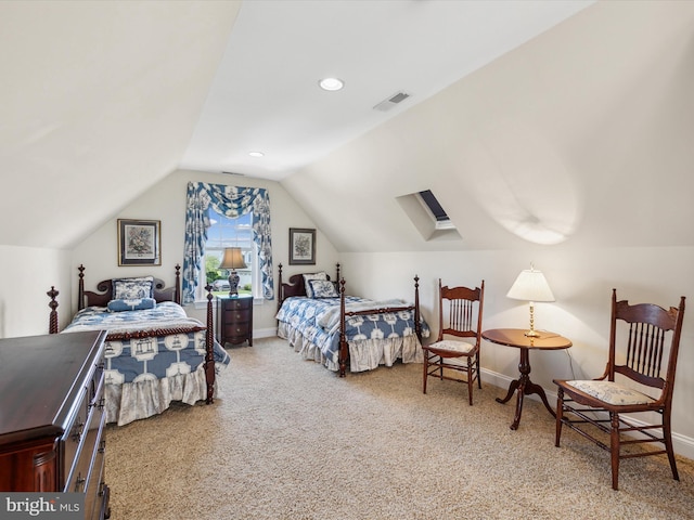 carpeted bedroom with vaulted ceiling