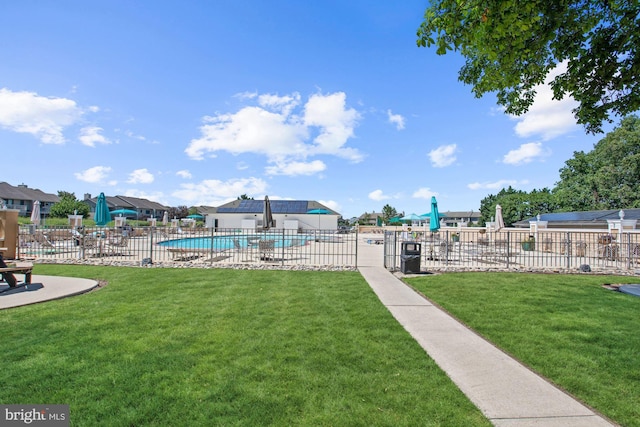 view of yard with a community pool