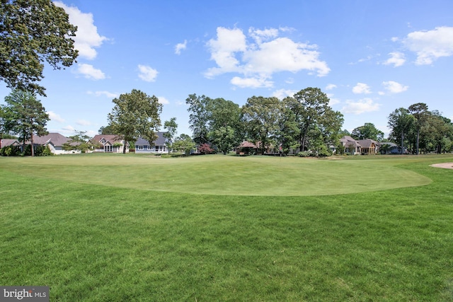 view of property's community featuring a yard