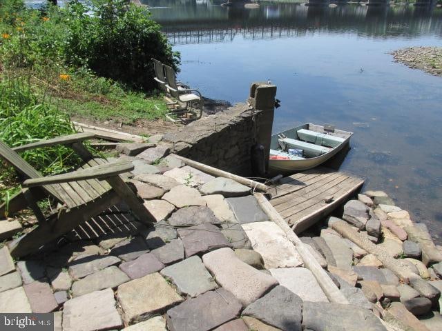 dock area with a water view