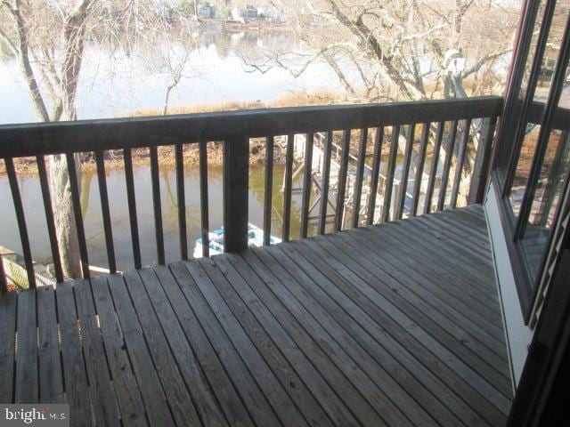 wooden deck with a water view