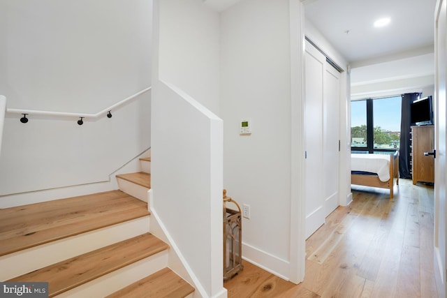 staircase featuring hardwood / wood-style floors