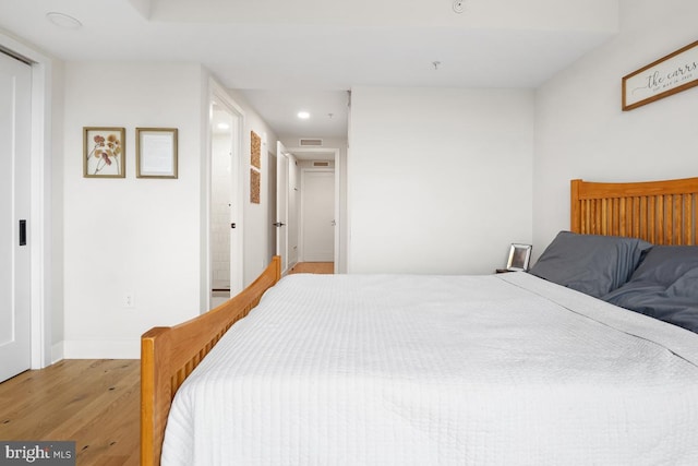 bedroom with light hardwood / wood-style flooring