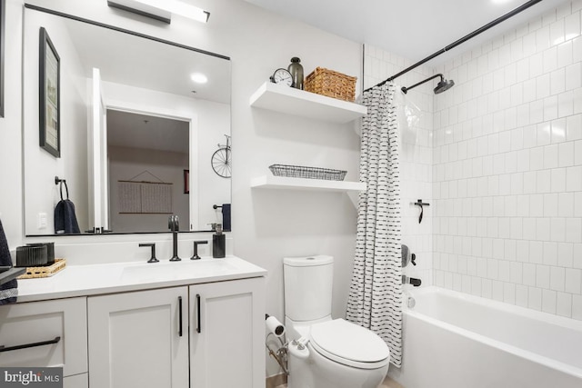 full bathroom with vanity, shower / bath combination with curtain, and toilet