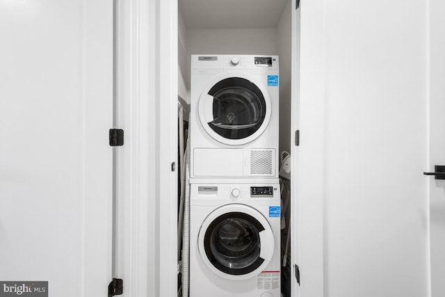 laundry area with stacked washer / drying machine