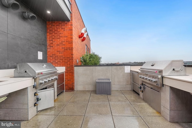 view of patio / terrace featuring a grill and exterior kitchen