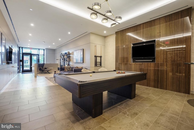 rec room featuring pool table, expansive windows, and french doors