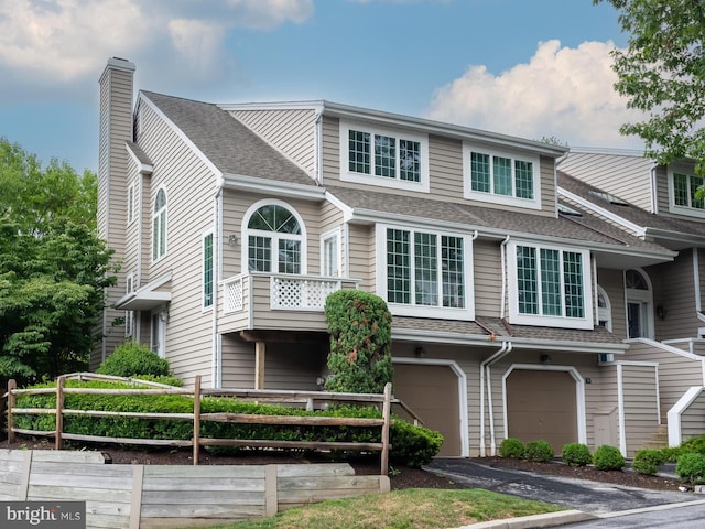 view of front of property with a garage