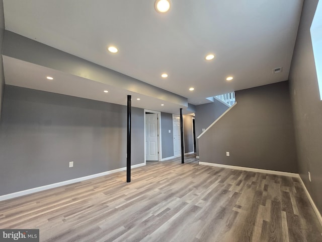 basement featuring light hardwood / wood-style floors