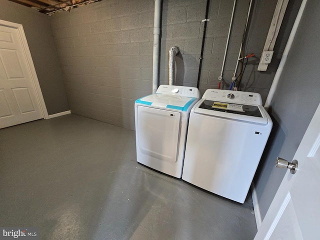 clothes washing area featuring washing machine and clothes dryer