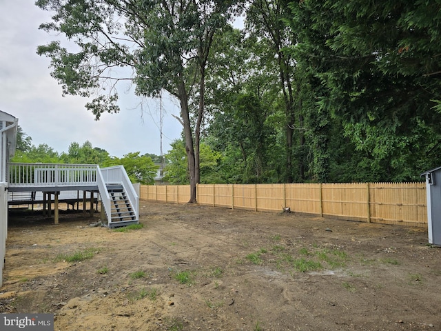 view of yard featuring a wooden deck