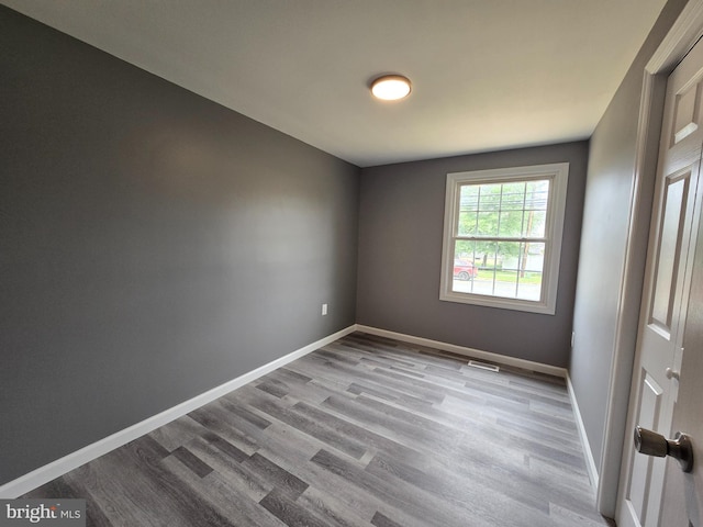 unfurnished room with light hardwood / wood-style flooring