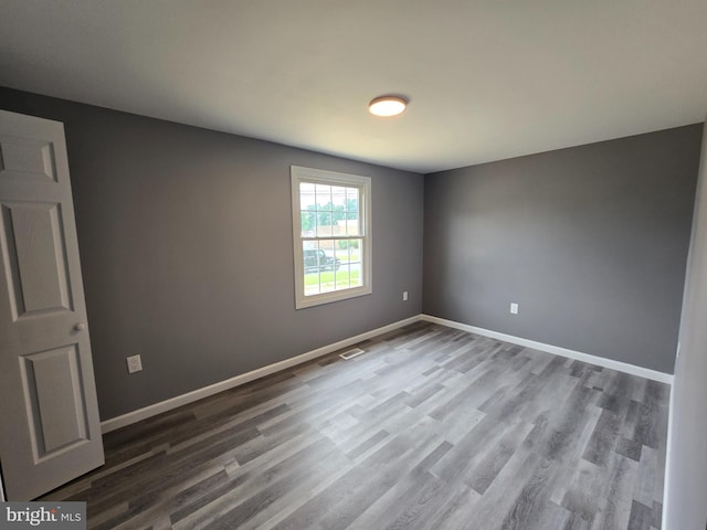 spare room featuring hardwood / wood-style flooring