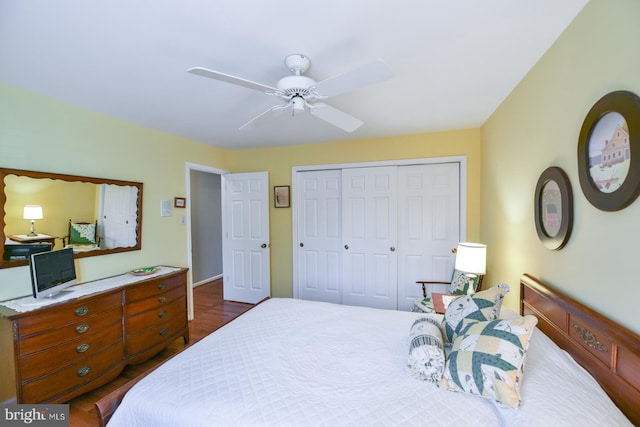 bedroom with ceiling fan, a closet, and dark hardwood / wood-style flooring