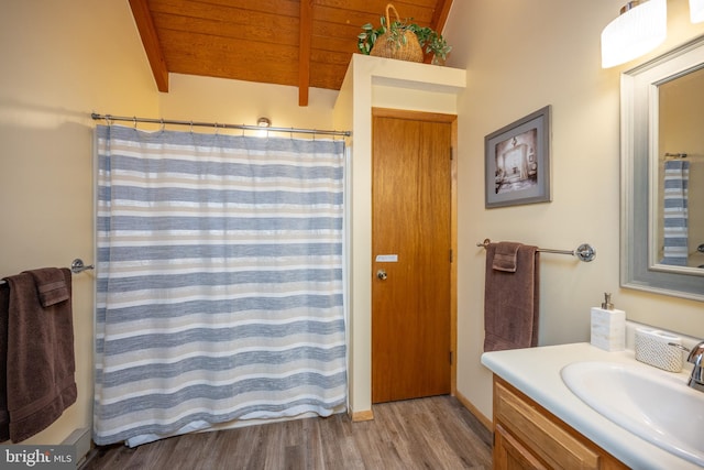 bathroom with wood ceiling, vanity, hardwood / wood-style flooring, and vaulted ceiling with beams