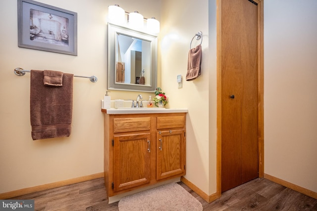 bathroom with vanity and hardwood / wood-style floors