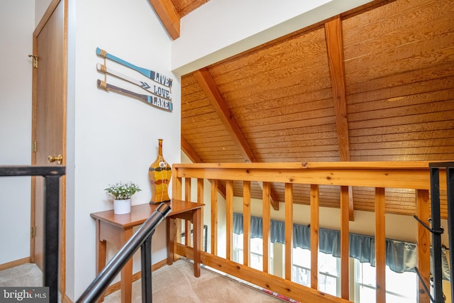 carpeted bedroom featuring wooden ceiling and lofted ceiling with beams