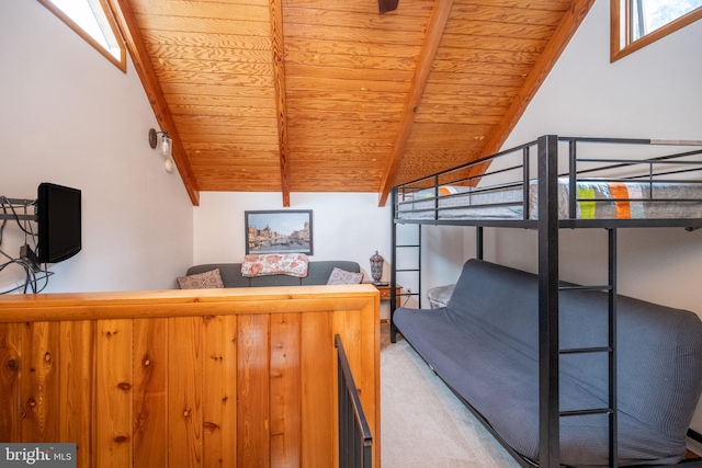 bedroom with lofted ceiling, carpet flooring, and wooden ceiling