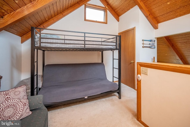 carpeted bedroom featuring beam ceiling, wood ceiling, and high vaulted ceiling