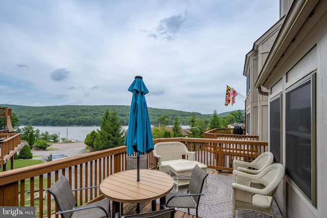 deck featuring a water view