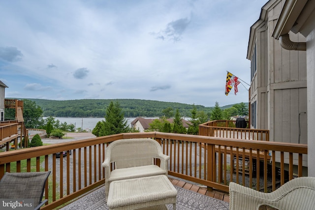 wooden deck featuring a water view