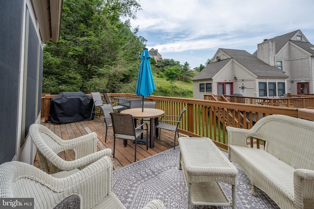 wooden terrace featuring area for grilling