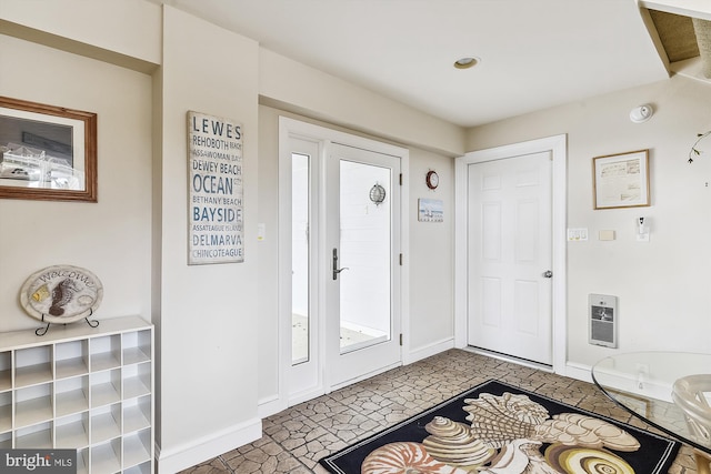 entryway with heating unit and baseboards