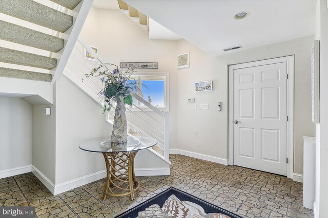 foyer featuring tile patterned floors