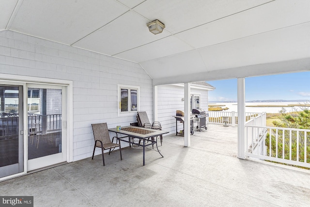 view of patio with outdoor dining area and area for grilling